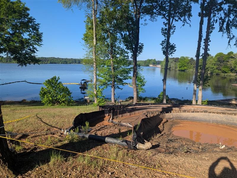 Lake dredging work in progress near the beach at North Shore Landing
